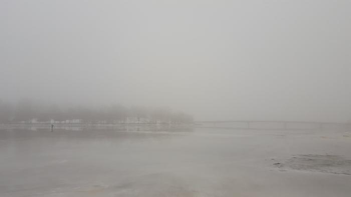 A grey and gloomy winter day in Helsinki, Finland. Mild air streamed in after freezing temperatures, and humidity in the air condensed into a fog.